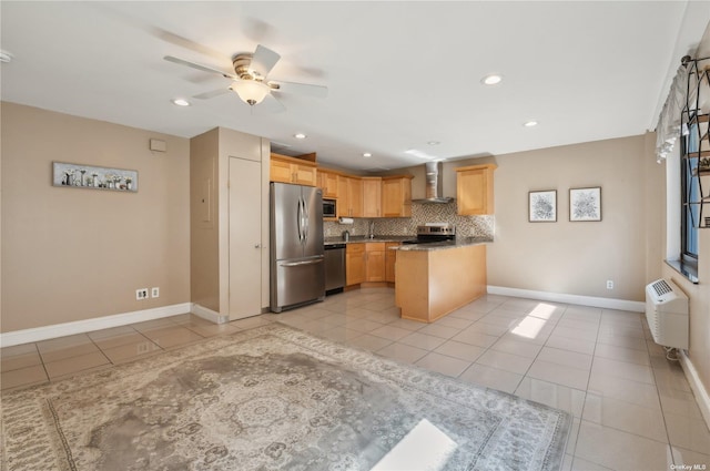 425 Shore Rd Unit 2B, Long Beach, NY 11561 - kitchen with stainless steel appliances, wall chimney range hood, light tile patterned floors, backsplash, and a peninsula