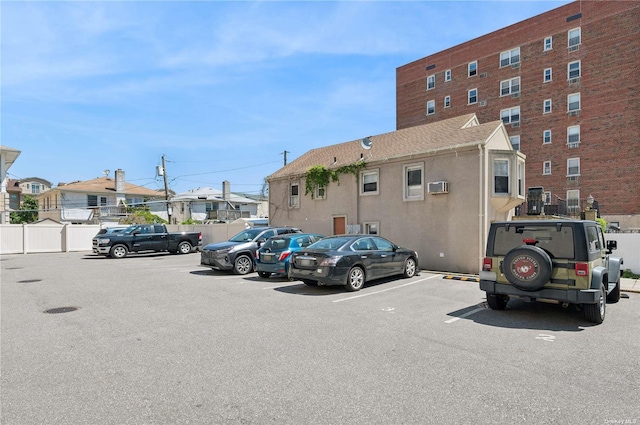425 Shore Rd Unit 2B, Long Beach, NY 11561 - uncovered parking lot with a residential view