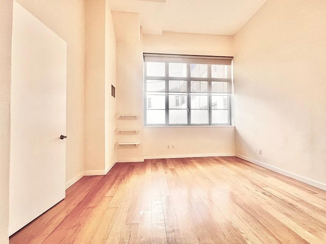 2728 Thomson Ave Unit 434, Long Island City, NY 11101 - unfurnished room featuring wood finished floors and baseboards