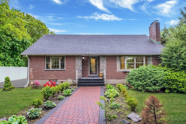 112 Clay Pitts Rd, Greenlawn, NY 11740 - view of front of house with a shingled roof, a chimney, and brick siding