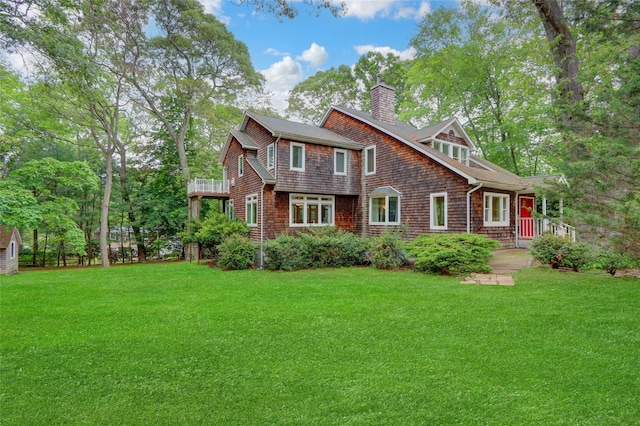 23 Knox Ave, Stony Brook, NY 11790 - shingle-style home featuring a chimney, a front yard, and a balcony