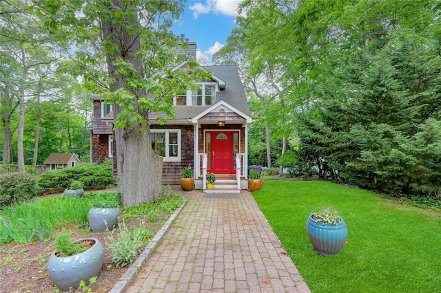 23 Knox Ave, Stony Brook, NY 11790 - view of front of house with a front yard and a chimney
