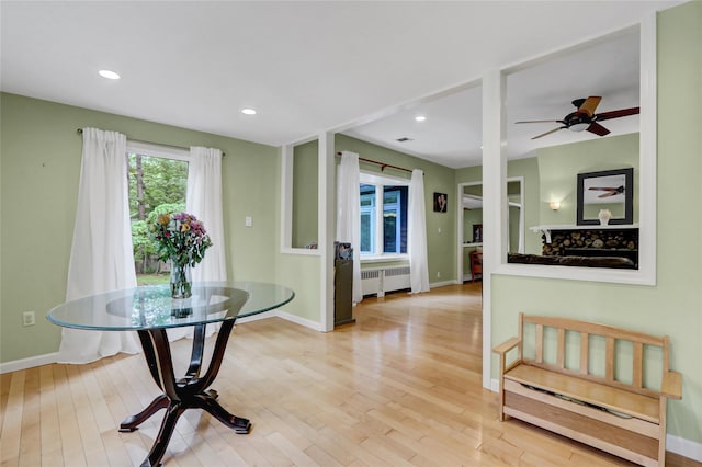 23 Knox Ave, Stony Brook, NY 11790 - dining room featuring radiator, light wood-style flooring, baseboards, a ceiling fan, and recessed lighting