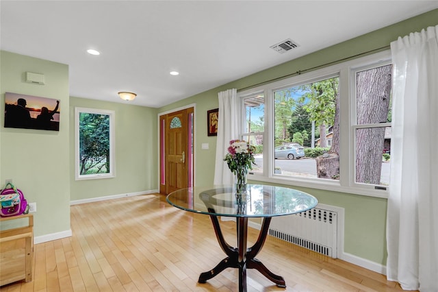 23 Knox Ave, Stony Brook, NY 11790 - foyer entrance featuring radiator, baseboards, healthy amount of natural light, wood-type flooring, and recessed lighting