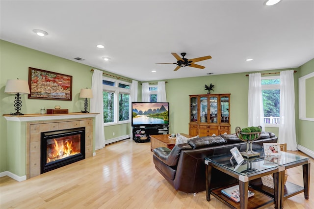 23 Knox Ave, Stony Brook, NY 11790 - living area with baseboard heating, plenty of natural light, wood finished floors, and recessed lighting
