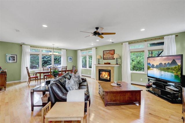 23 Knox Ave, Stony Brook, NY 11790 - living room with a baseboard heating unit, light wood-style flooring, ceiling fan, baseboards, and recessed lighting