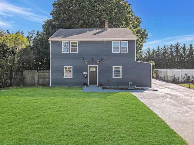 322 Lansdowne Ave, Carle Place, NY 11514 - view of front of home featuring a chimney and concrete driveway
