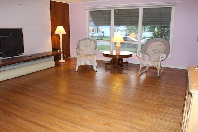 113 Pine Neck Ave, East Patchogue, NY 11772 - sitting room with wood finished floors and baseboards