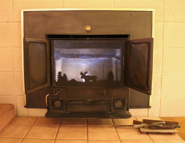 113 Pine Neck Ave, East Patchogue, NY 11772 - detailed view of a glass covered fireplace and concrete block wall