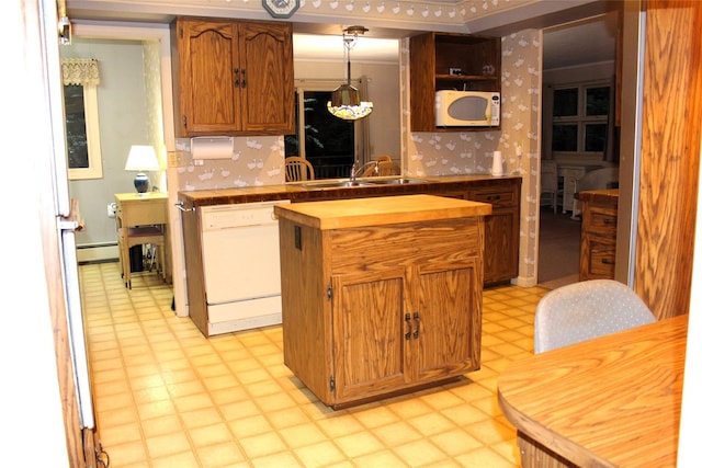 113 Pine Neck Ave, East Patchogue, NY 11772 - kitchen with white appliances, light flooring, wood counters, a baseboard heating unit, and a sink