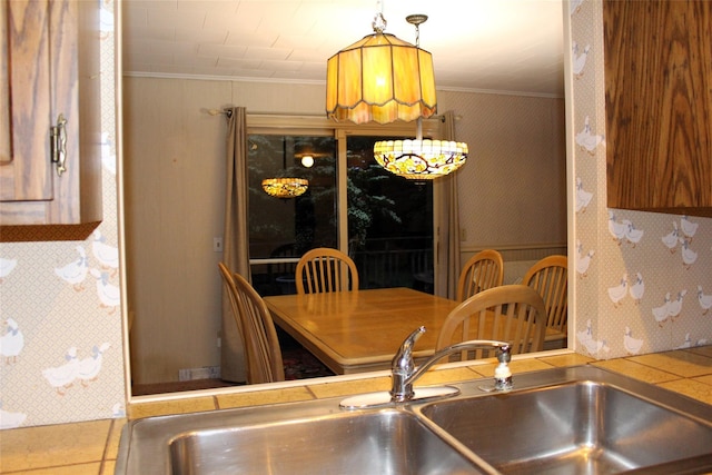 113 Pine Neck Ave, East Patchogue, NY 11772 - kitchen with a sink, ornamental molding, wallpapered walls, and tile countertops