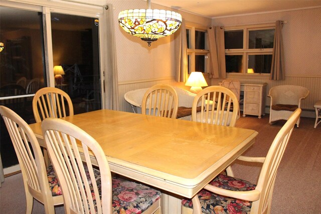 113 Pine Neck Ave, East Patchogue, NY 11772 - carpeted dining space with wallpapered walls and crown molding