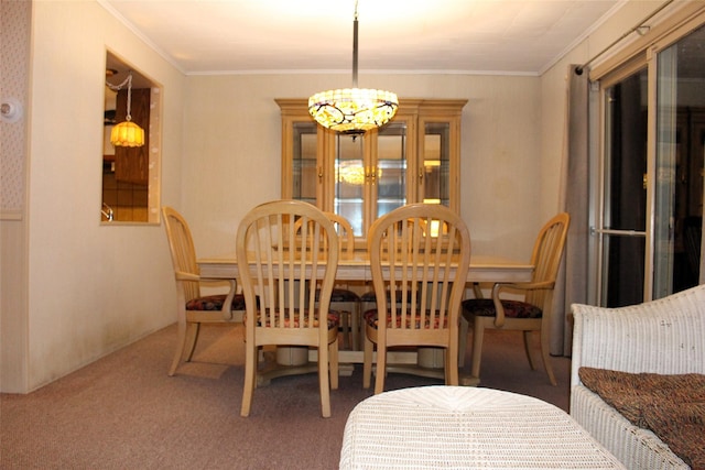113 Pine Neck Ave, East Patchogue, NY 11772 - dining area with carpet floors, a chandelier, and crown molding