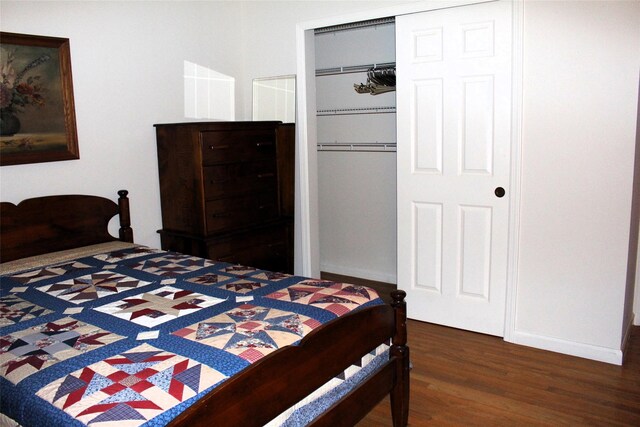 113 Pine Neck Ave, East Patchogue, NY 11772 - bedroom with wood finished floors, a closet, and baseboards