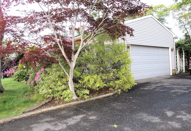 113 Pine Neck Ave, East Patchogue, NY 11772 - view of property exterior with a garage
