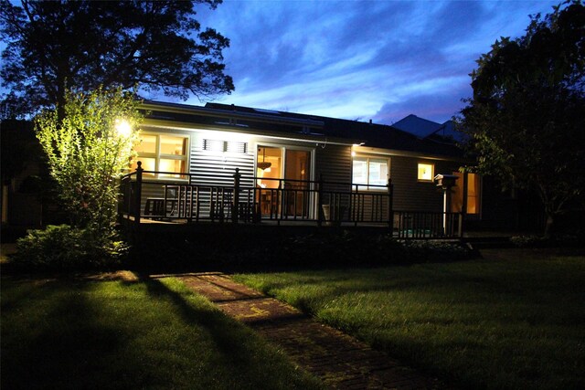 113 Pine Neck Ave, East Patchogue, NY 11772 - back of property at dusk with a lawn
