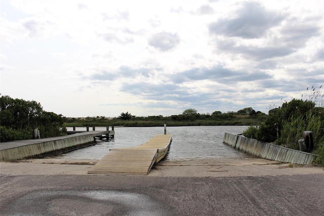 113 Pine Neck Ave, East Patchogue, NY 11772 - dock featuring a boat ramp and a water view