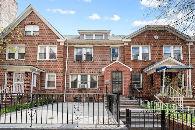 34-15 91st St, Jackson Heights, NY 11372 - multi unit property with brick siding and a fenced front yard