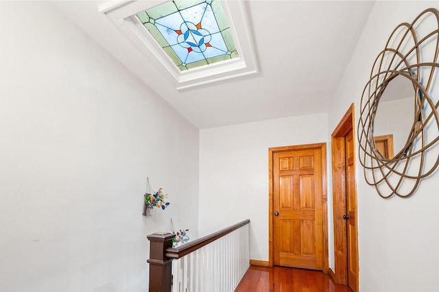 34-15 91st St, Jackson Heights, NY 11372 - corridor with a skylight, wood finished floors, an upstairs landing, and baseboards