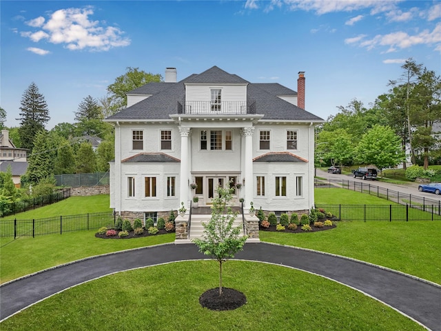 158 Loring Ave, Pelham, NY 10803 - greek revival inspired property with a chimney, a balcony, and french doors