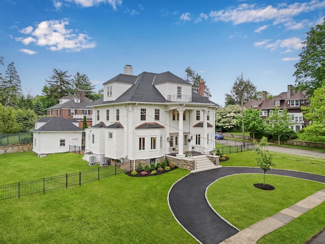 158 Loring Ave, Pelham, NY 10803 - view of front of home featuring a chimney, a balcony, driveway, central AC, and a shingled roof