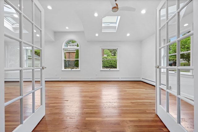 158 Loring Ave, Pelham, NY 10803 - unfurnished room with a skylight, wood finished floors, and recessed lighting