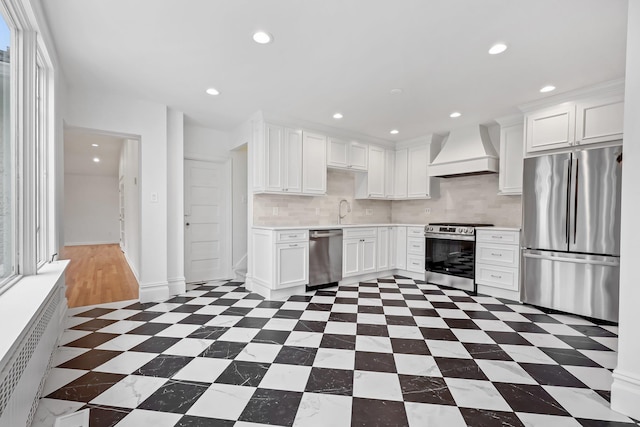 158 Loring Ave, Pelham, NY 10803 - kitchen with stainless steel appliances, custom exhaust hood, light countertops, white cabinets, and recessed lighting
