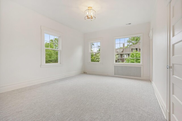 158 Loring Ave, Pelham, NY 10803 - empty room with plenty of natural light, a chandelier, light carpet, and baseboards