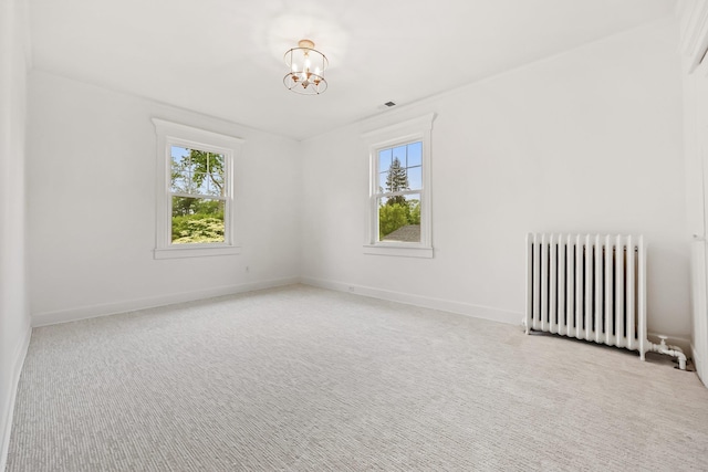 158 Loring Ave, Pelham, NY 10803 - unfurnished room featuring radiator heating unit, a chandelier, carpet flooring, and baseboards