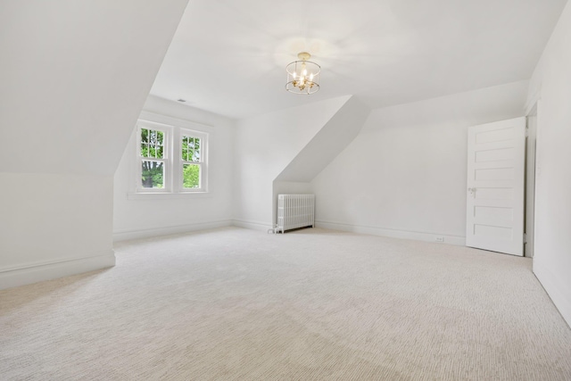 158 Loring Ave, Pelham, NY 10803 - bonus room featuring vaulted ceiling, radiator heating unit, carpet flooring, a chandelier, and baseboards