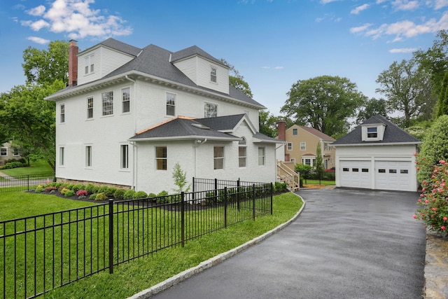158 Loring Ave, Pelham, NY 10803 - view of side of home featuring a garage, a chimney, and an outdoor structure