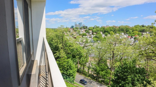 200 High Point Dr Unit 302, Hartsdale, NY 10530 - balcony featuring view of wooded area and a city view