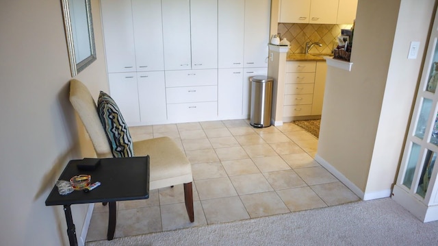200 High Point Dr Unit 302, Hartsdale, NY 10530 - corridor with a sink, light tile patterned floors, and baseboards