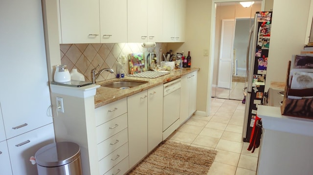 200 High Point Dr Unit 302, Hartsdale, NY 10530 - kitchen featuring a sink, dishwasher, backsplash, light tile patterned floors, and white cabinetry