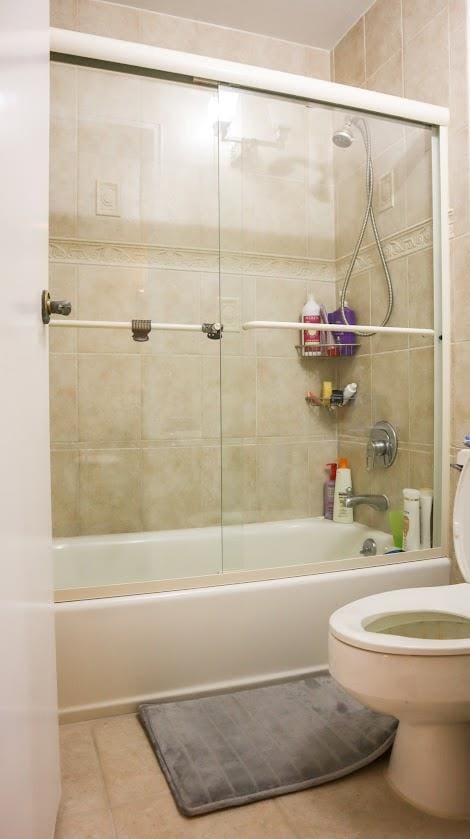 200 High Point Dr Unit 302, Hartsdale, NY 10530 - bathroom with tile patterned floors,  shower combination, and toilet