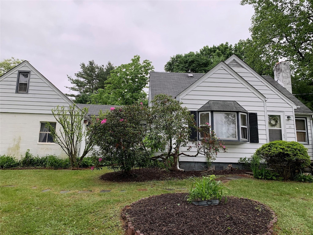 48 Sedgewick Rd, Poughkeepsie, NY 12603 - view of front of property featuring a chimney, a front lawn, and a shingled roof