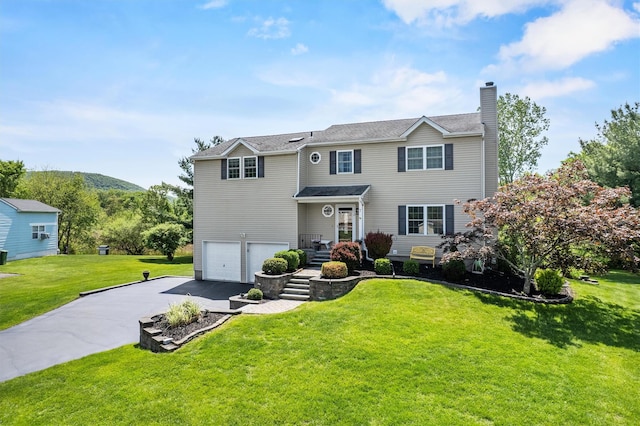 7 Pilgrim Ln, Washingtonville, NY 10992 - view of front of home with asphalt driveway, a chimney, an attached garage, and a front lawn