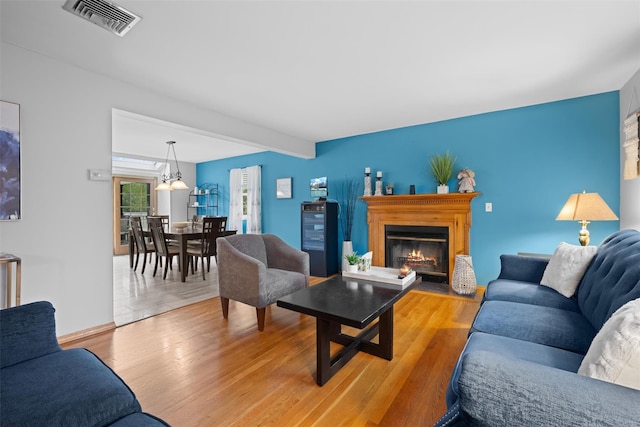 7 Pilgrim Ln, Washingtonville, NY 10992 - living area with wood finished floors and a glass covered fireplace