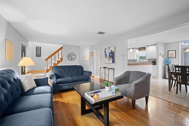 7 Pilgrim Ln, Washingtonville, NY 10992 - living room featuring stairs and light wood-style floors