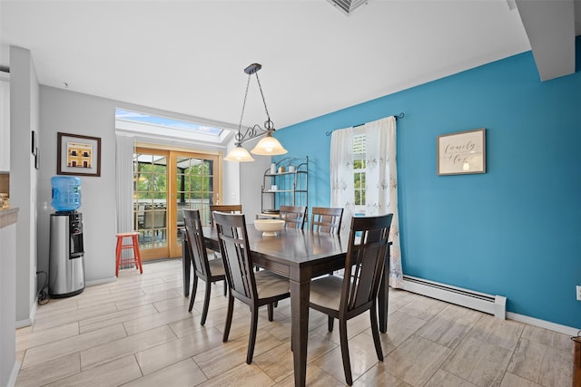 7 Pilgrim Ln, Washingtonville, NY 10992 - dining area with a baseboard radiator, a skylight, baseboards, and wood finish floors