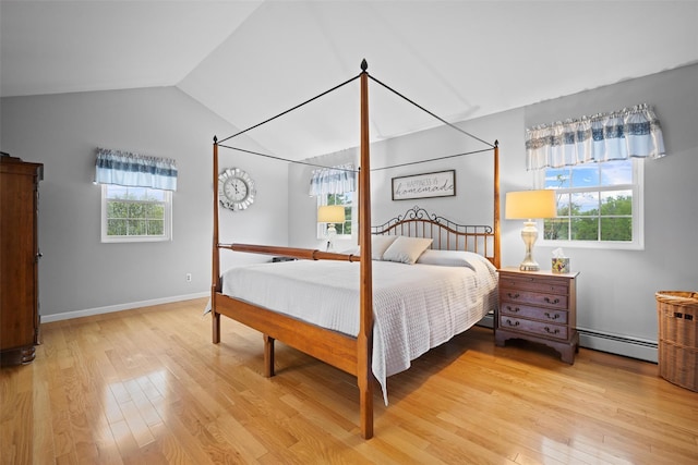 7 Pilgrim Ln, Washingtonville, NY 10992 - bedroom featuring baseboard heating, light wood finished floors, lofted ceiling, and baseboards