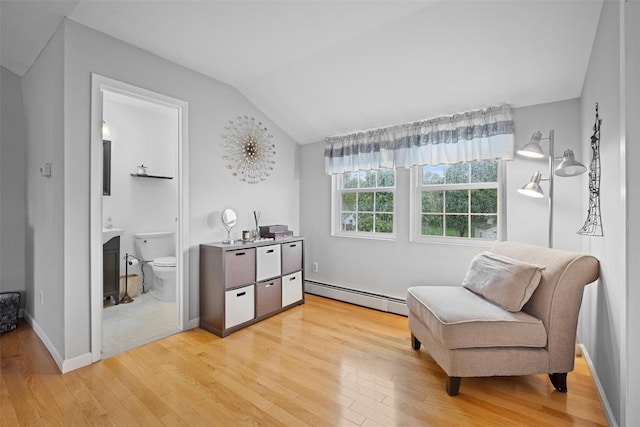 7 Pilgrim Ln, Washingtonville, NY 10992 - living area with baseboard heating, light wood-style floors, vaulted ceiling, and a fireplace