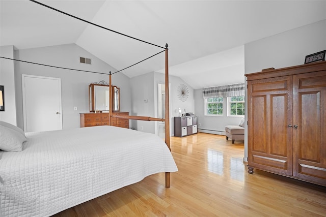 7 Pilgrim Ln, Washingtonville, NY 10992 - bedroom featuring lofted ceiling, a baseboard radiator, and light wood-style flooring