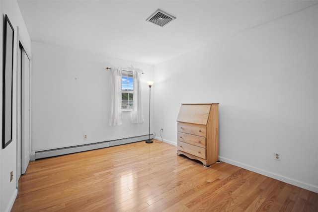 7 Pilgrim Ln, Washingtonville, NY 10992 - unfurnished bedroom with baseboard heating, light wood-style floors, and baseboards