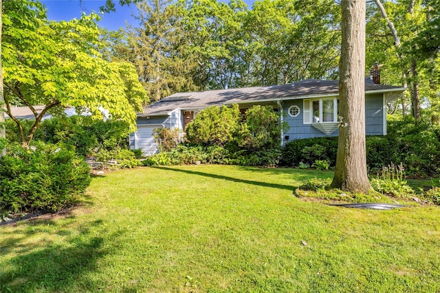 810 Tooker Ave, West Babylon, NY 11704 - view of front of home with a front yard and a chimney