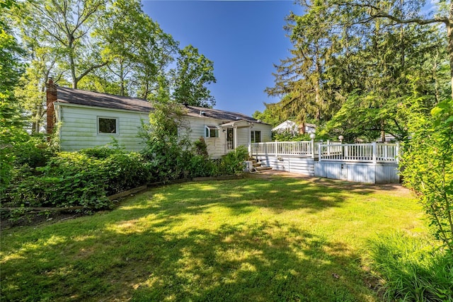 810 Tooker Ave, West Babylon, NY 11704 - view of grassy yard with a deck