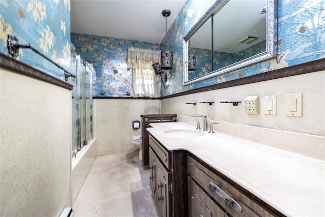 810 Tooker Ave, West Babylon, NY 11704 - full bath with wallpapered walls, vanity, combined bath / shower with glass door, and wainscoting