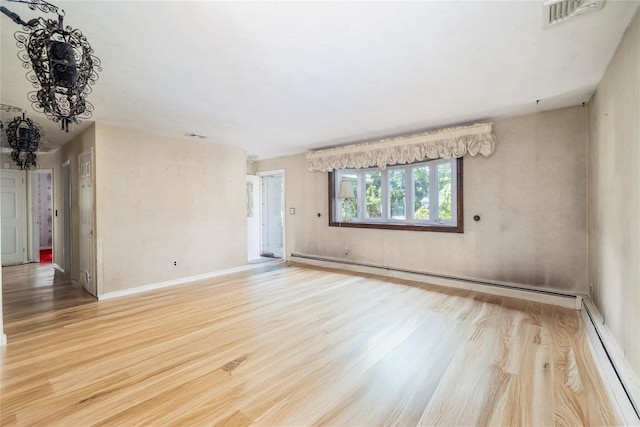 810 Tooker Ave, West Babylon, NY 11704 - unfurnished room featuring baseboard heating and light wood-type flooring