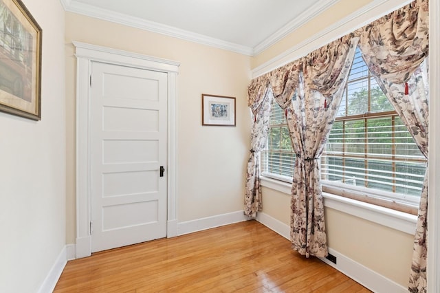 57 Maple Ave, Bay Shore, NY 11706 - unfurnished room featuring ornamental molding, light wood finished floors, and baseboards
