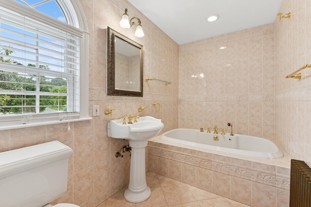 57 Maple Ave, Bay Shore, NY 11706 - bathroom featuring tile walls, radiator heating unit, a garden tub, tile patterned floors, and toilet